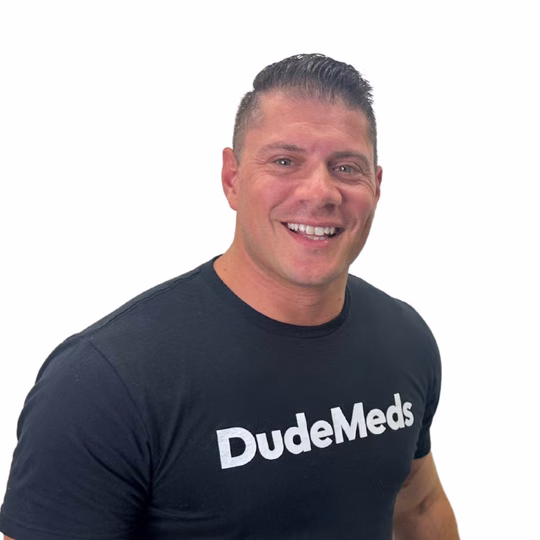DudeMeds co-founder smiling in a black DudeMeds shirt.